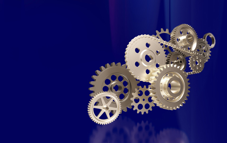 Mehrere Zahnräder auf blauem Hintergrund