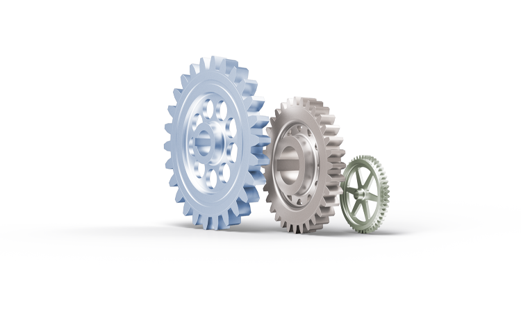 Drei Zahnräder in unterschiedlicher Größe und Farbe